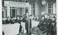 Rabbi Eliezer Silver speaking at an Agudath Israel Convention, also seen in the picture are Rabbi Aharon Kotler and Rabbi Moshe Feinstein